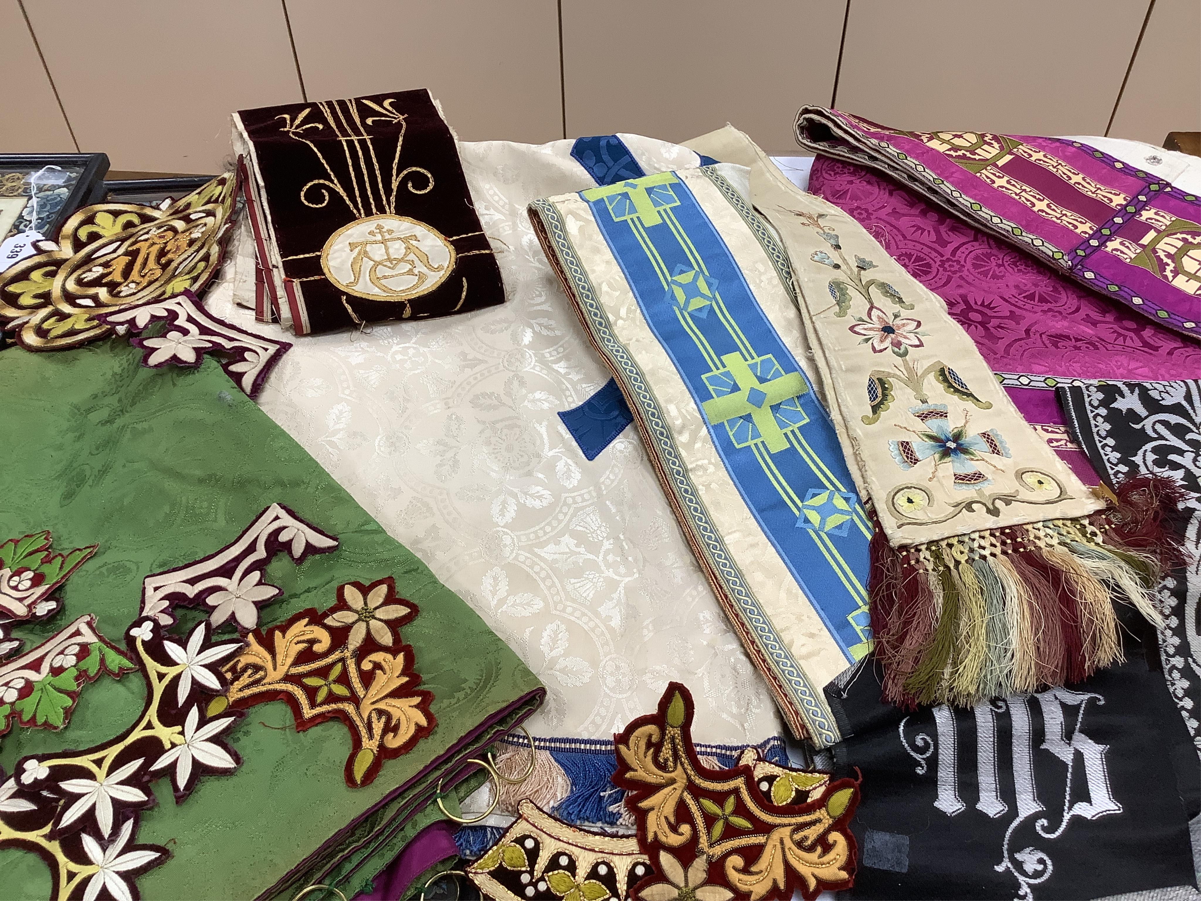 A collection of 20th century reversible coloured damask liturgical church hangings, together with a 19th century polychrome and gold embroidered cream silk stole with fringed ends. - 220cm long and a small collection of